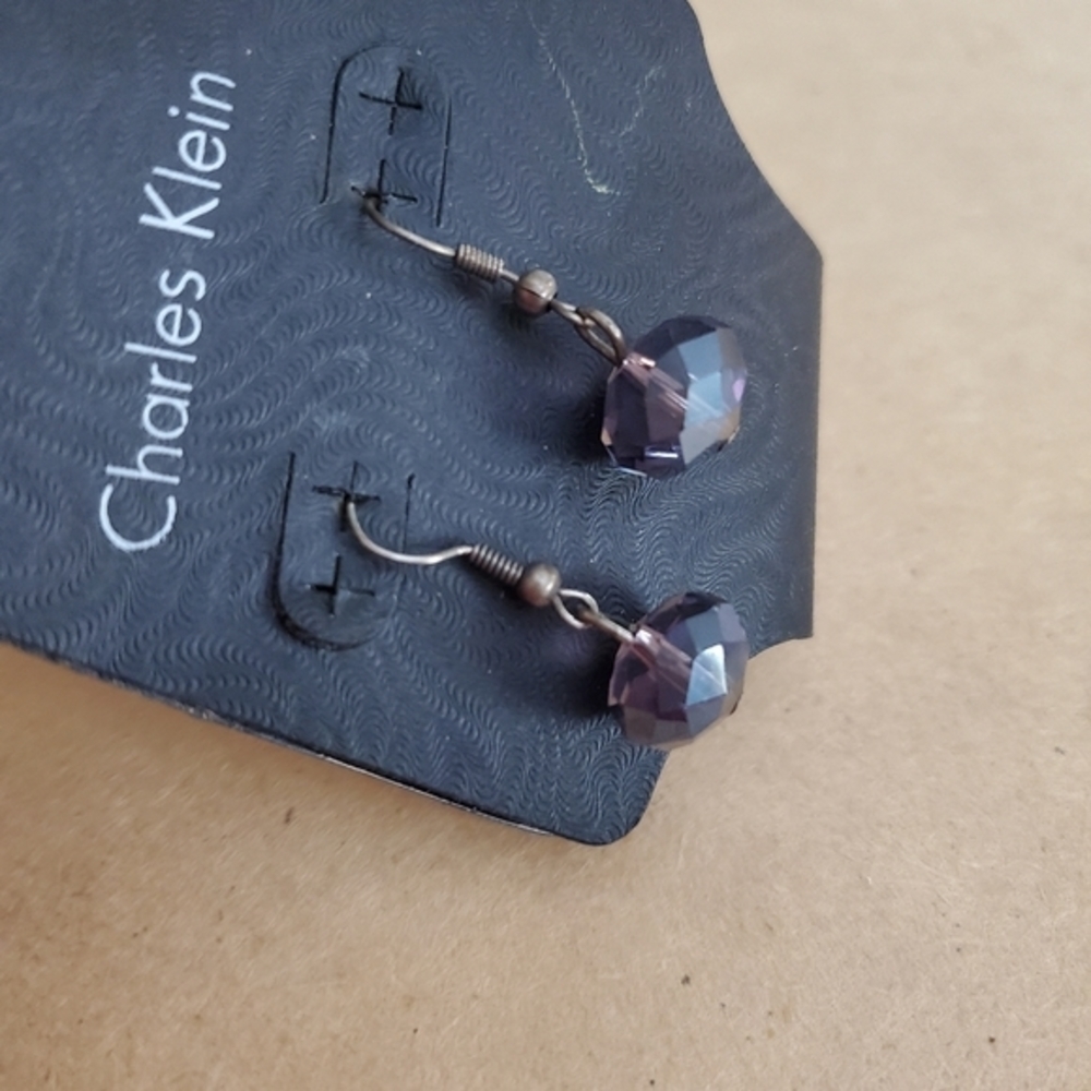 A lot of 3 Calvin Klein earrings with glass beads